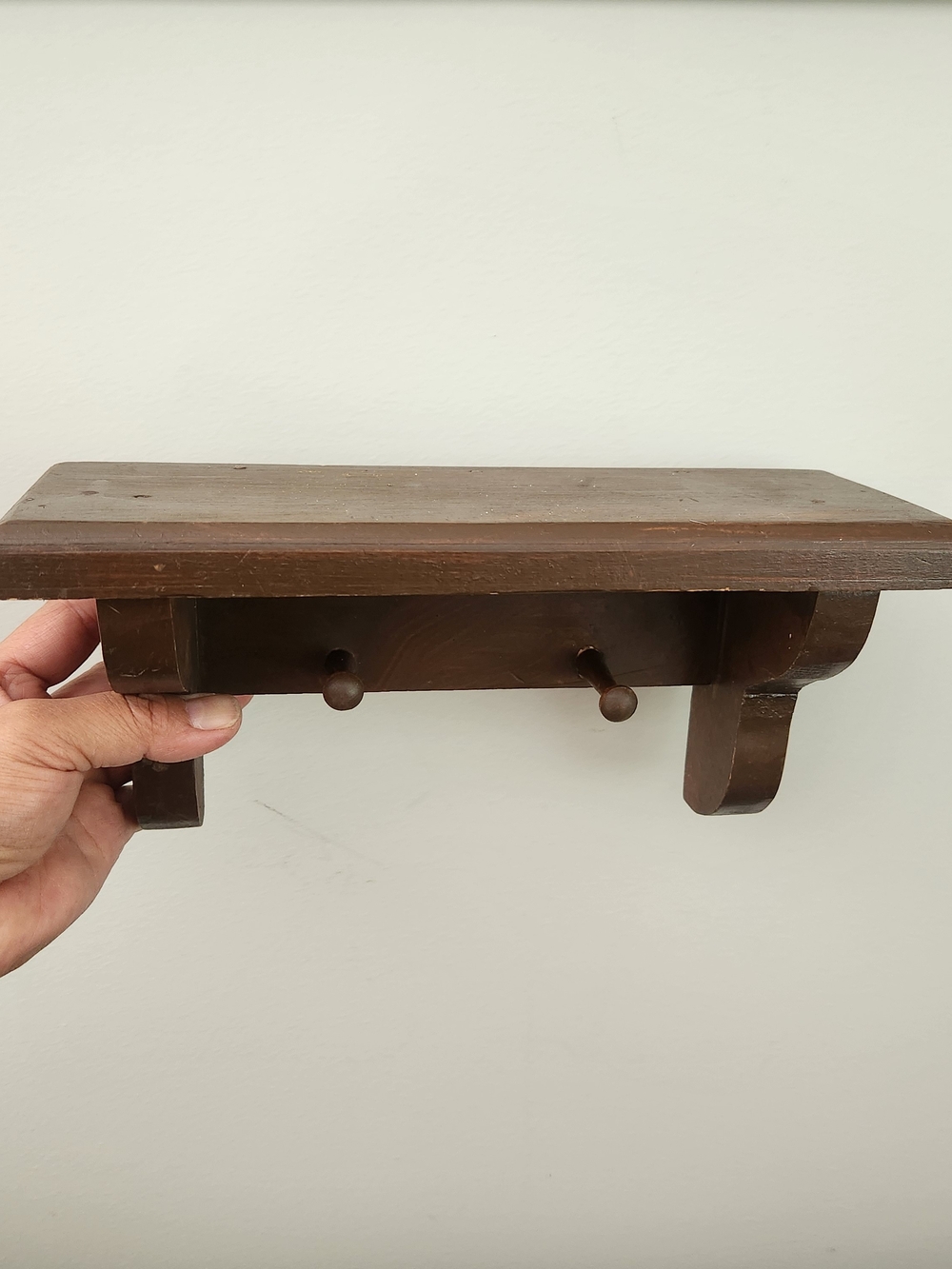 Rustic Brown Wooden Wall Shelf with Peg Hooks